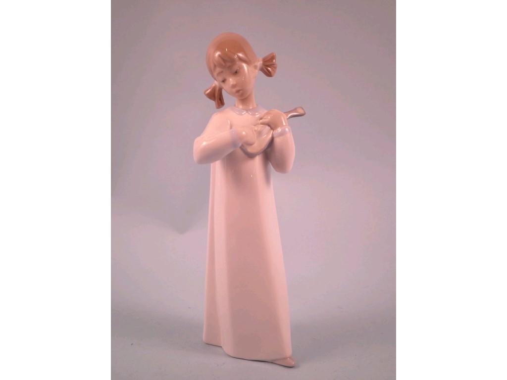 Appraisal: A Lladro figure of a young girl playing a flute