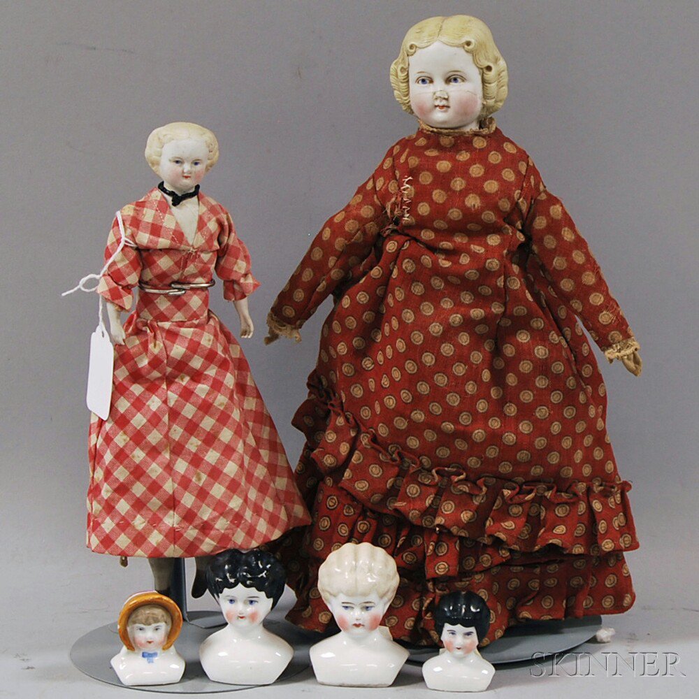 Appraisal: Two Small Parian-type Dolls and Four China Doll Heads Germany