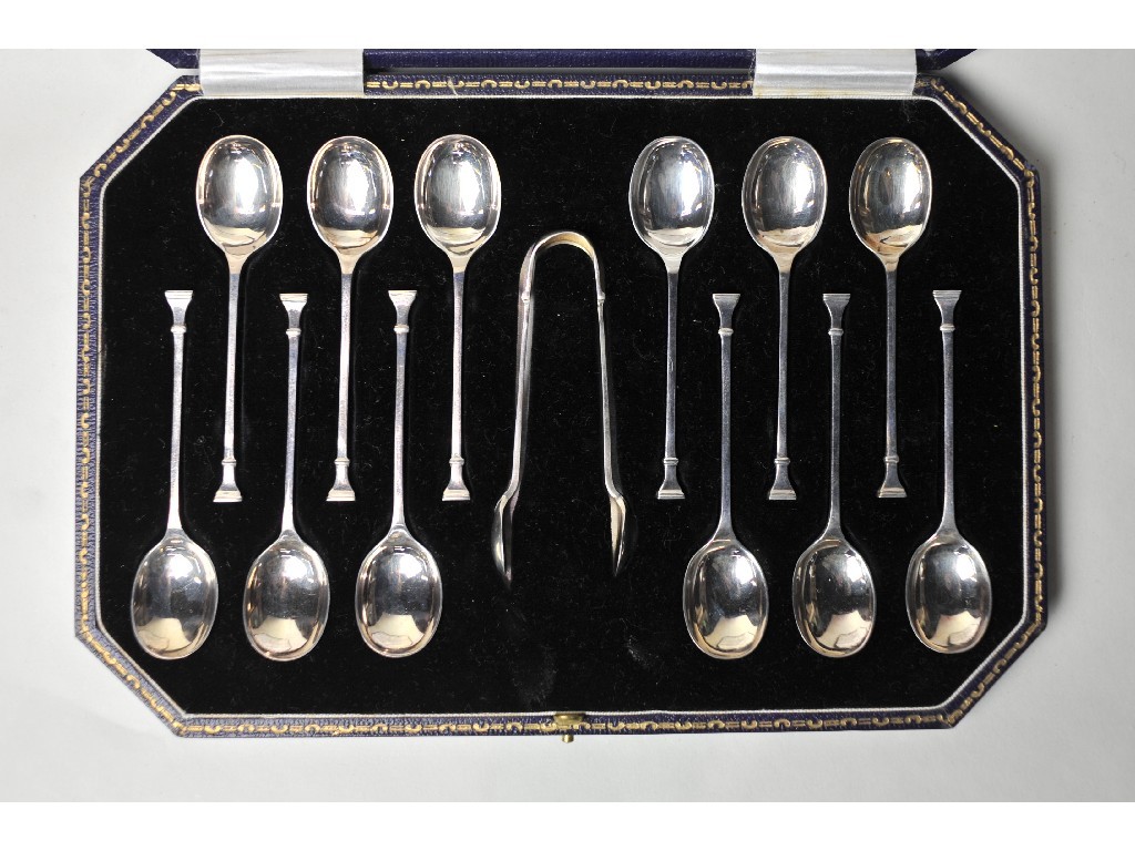 Appraisal: Cased set of twelve silver coffee spoons with tongs Sheffield