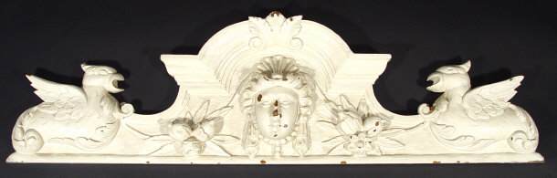 Appraisal: Painted and carved oak pediment with mask and bird decoration