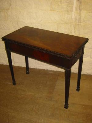 Appraisal: A GEORGE III MAHOGANY FOLDING TEA TABLE the oblong top