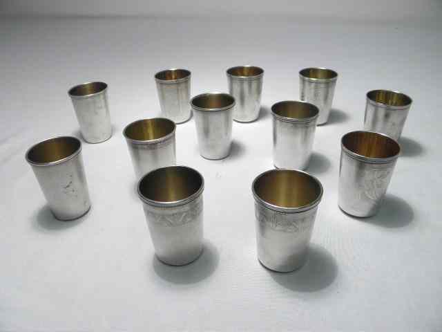 Appraisal: Twelve Russian silver shot glasses Eight have engraved patterns floral