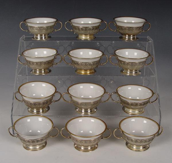 Appraisal: STERLING CREAM SOUP CUP HOLDERS WITH LIMOGES CHINA INSERTS Whiting