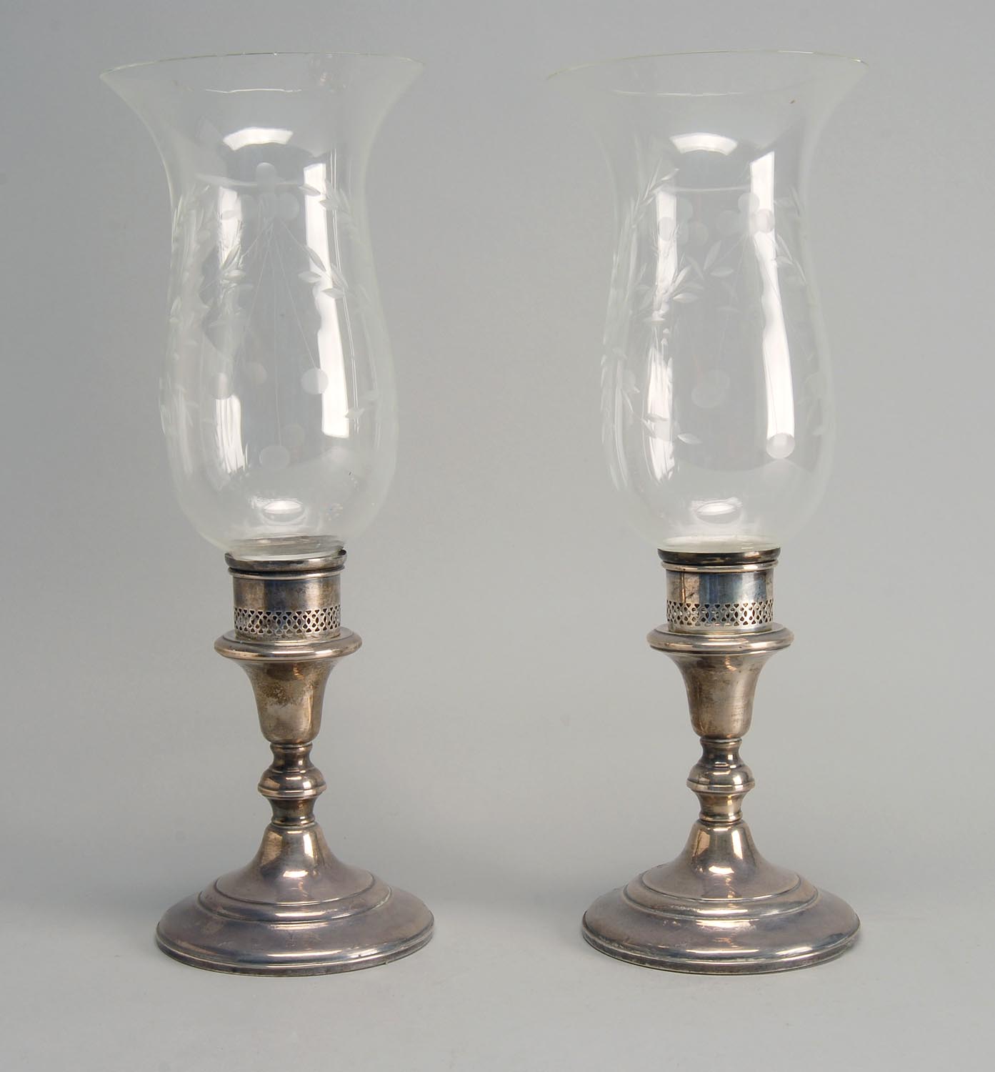 Appraisal: PAIR OF STERLING SILVER WEIGHTED CANDLESTICKS BY REDLICH CO With