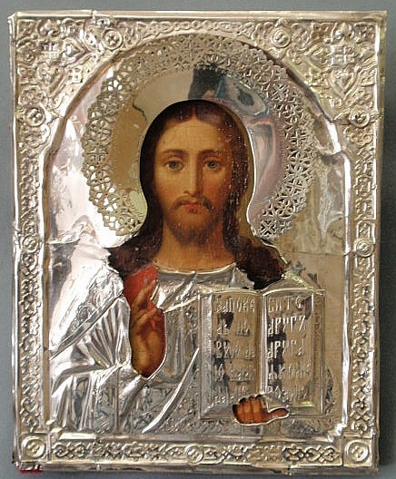 Appraisal: Russian icon painted on panel with silver surround x