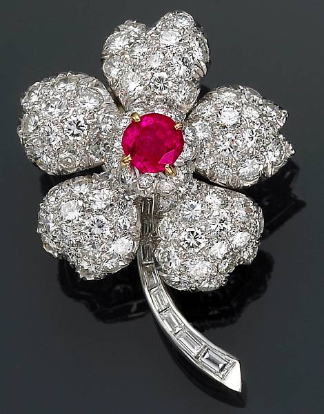 Appraisal: A ruby diamond platinum and eighteen karat gold flower brooch