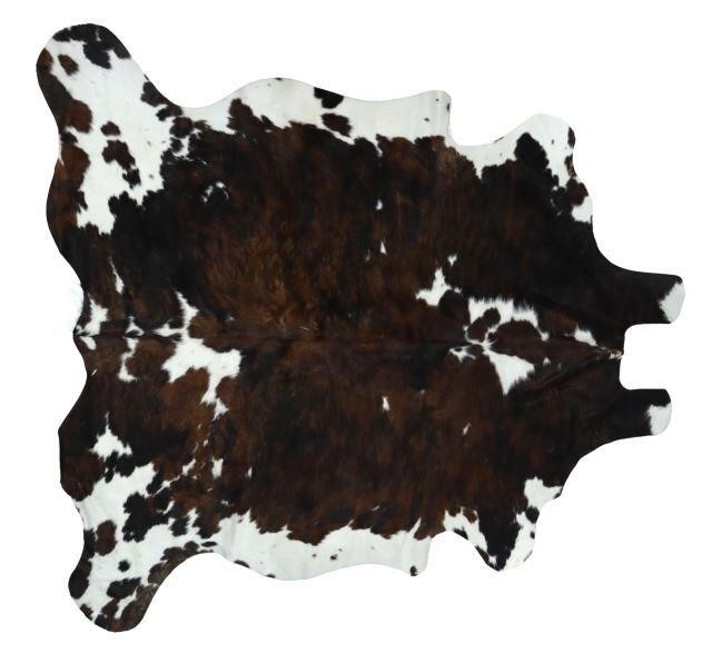 Appraisal: Cowhide black and brown brindle with some white largest measurements