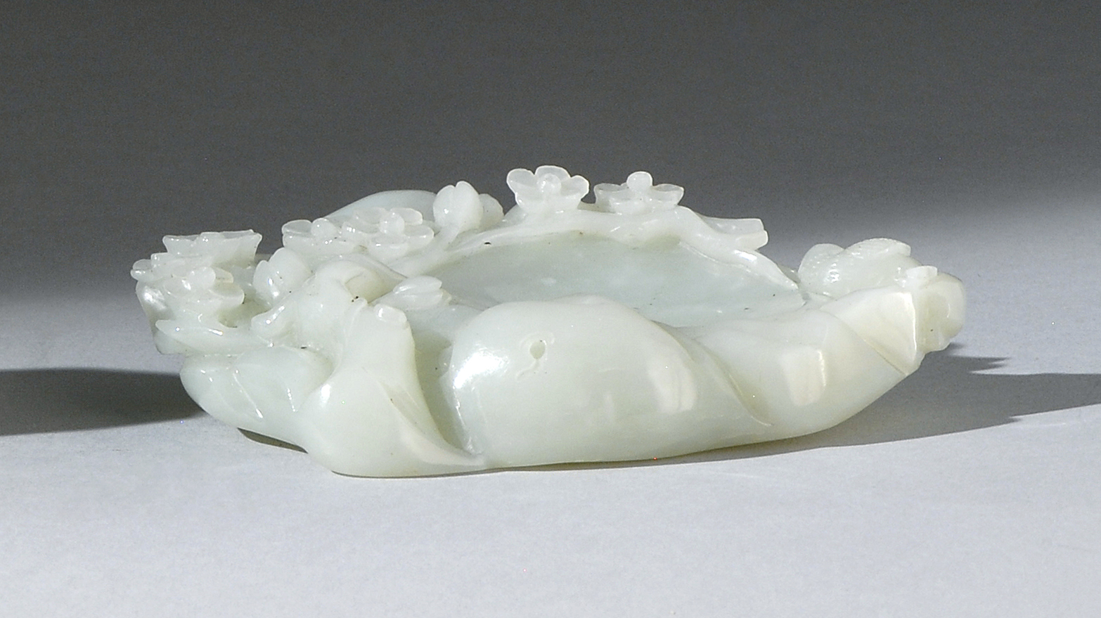 Appraisal: WHITE JADE BRUSH WASHER In pebble form with bird and