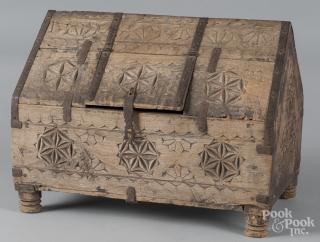 Appraisal: Continental carved pine chest with iron strapping th c h