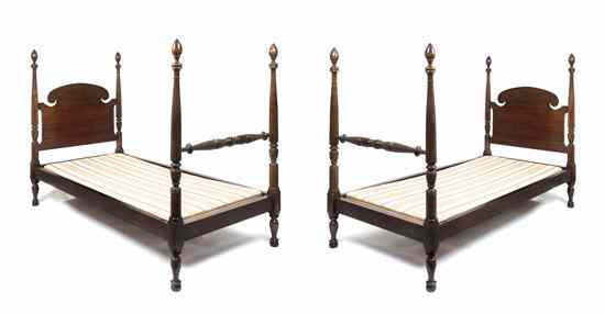 Appraisal: A Pair of Mahogany Twin Bed Frames having curved C-scroll