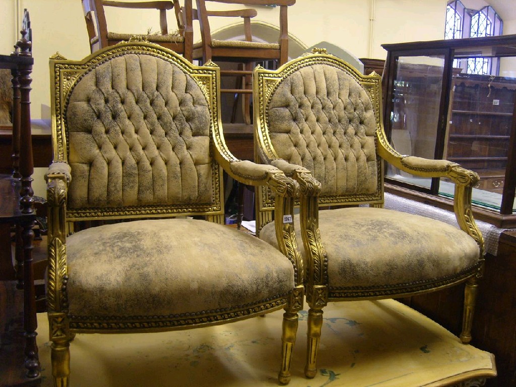 Appraisal: A pair of th century gilt armchairs with upholstered seats