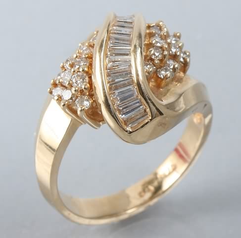 Appraisal: KY gold diamond ring stamped K round diamonds ctw baguette