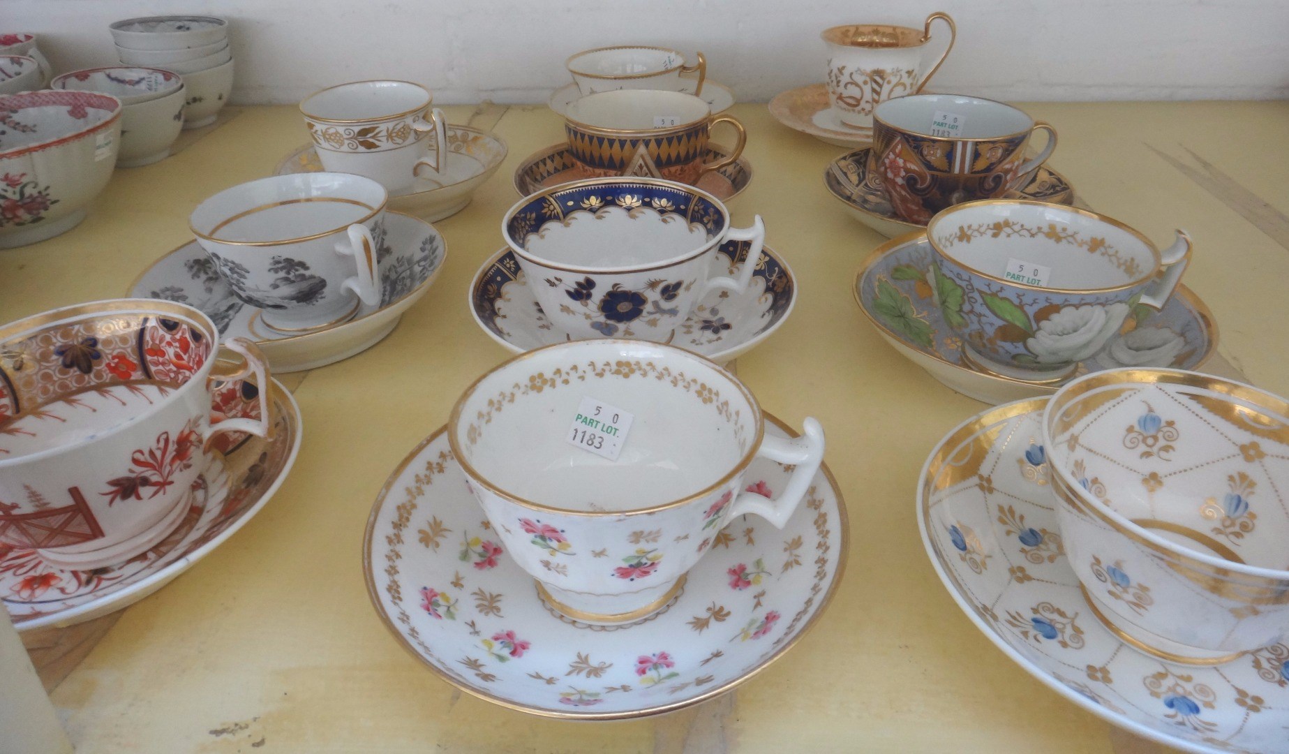 Appraisal: A group of eleven English porcelain teacups and saucers early