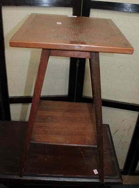 Appraisal: A LATE VICTORIAN OAK TWO TIER PLANT TABLE with beaten