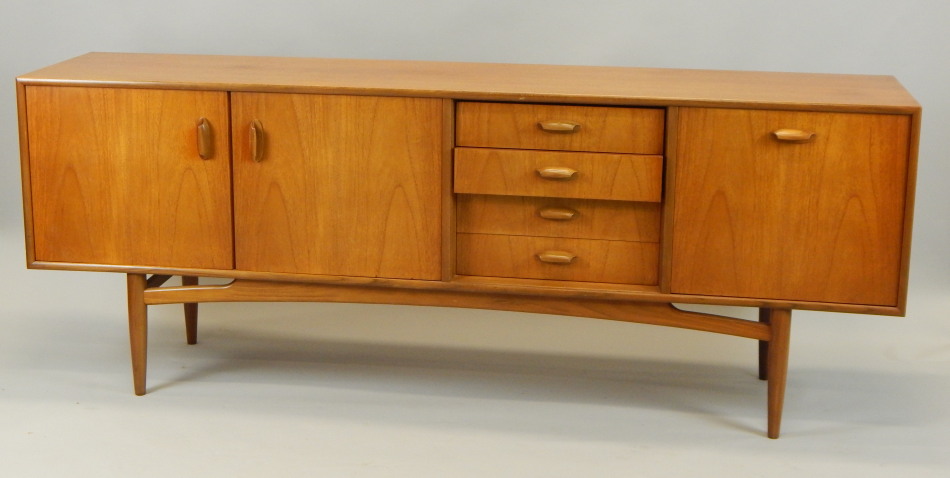 Appraisal: A 'G' plan style retro teak low sideboard with an