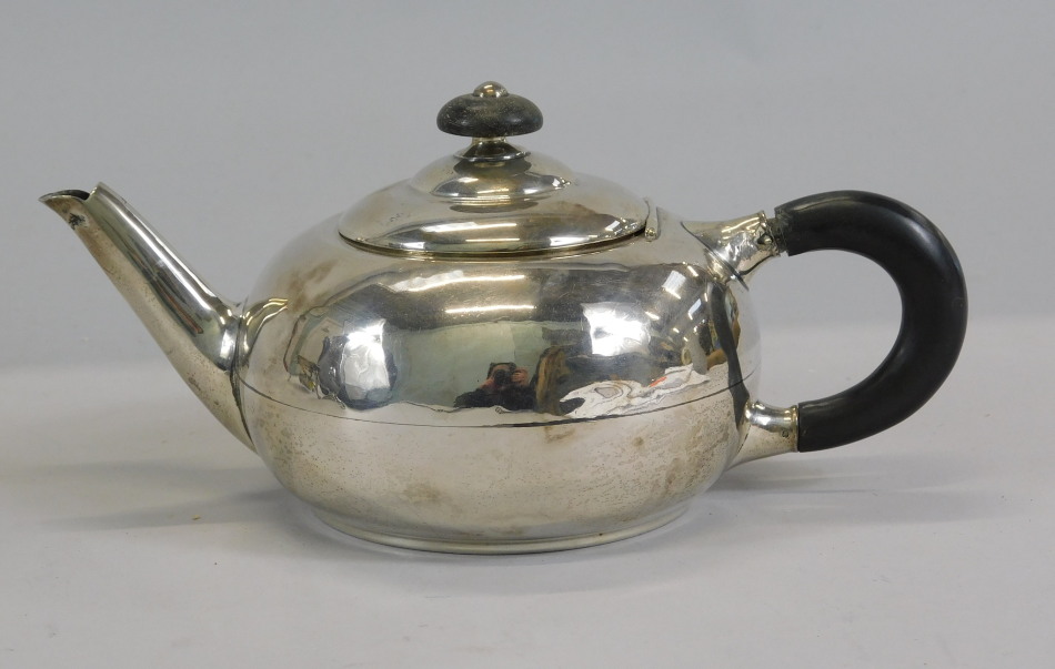 Appraisal: A George V silver bullet shaped silver teapot with ebonised