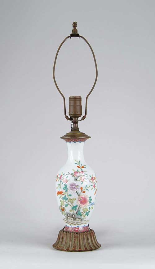 Appraisal: ORIENTAL VASE LAMP Decorated with flowers on a white ground