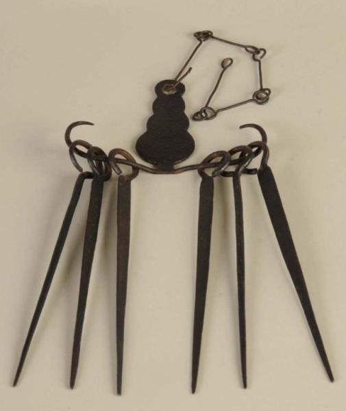 Appraisal: Wrought Iron Skewer Holder Description th Century Possibly American Together