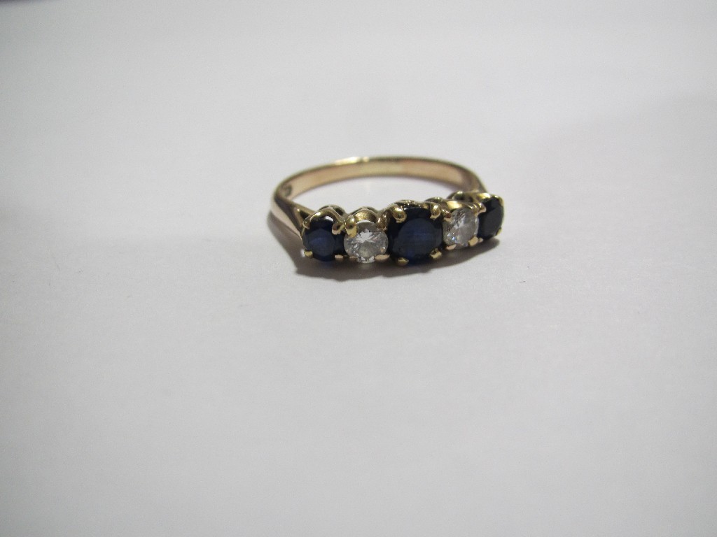 Appraisal: A five stone diamond and blue gem ring set in