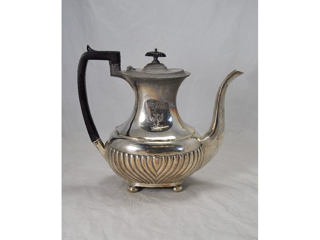 Appraisal: Half-fluted silver coffee pot on four ball feet with black