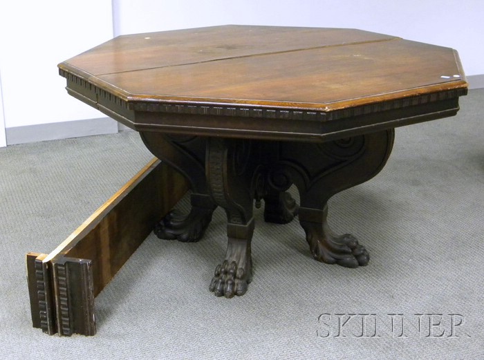 Appraisal: Jacobean-style Octagonal-top Carved Walnut Dining Table with Paw Feet including