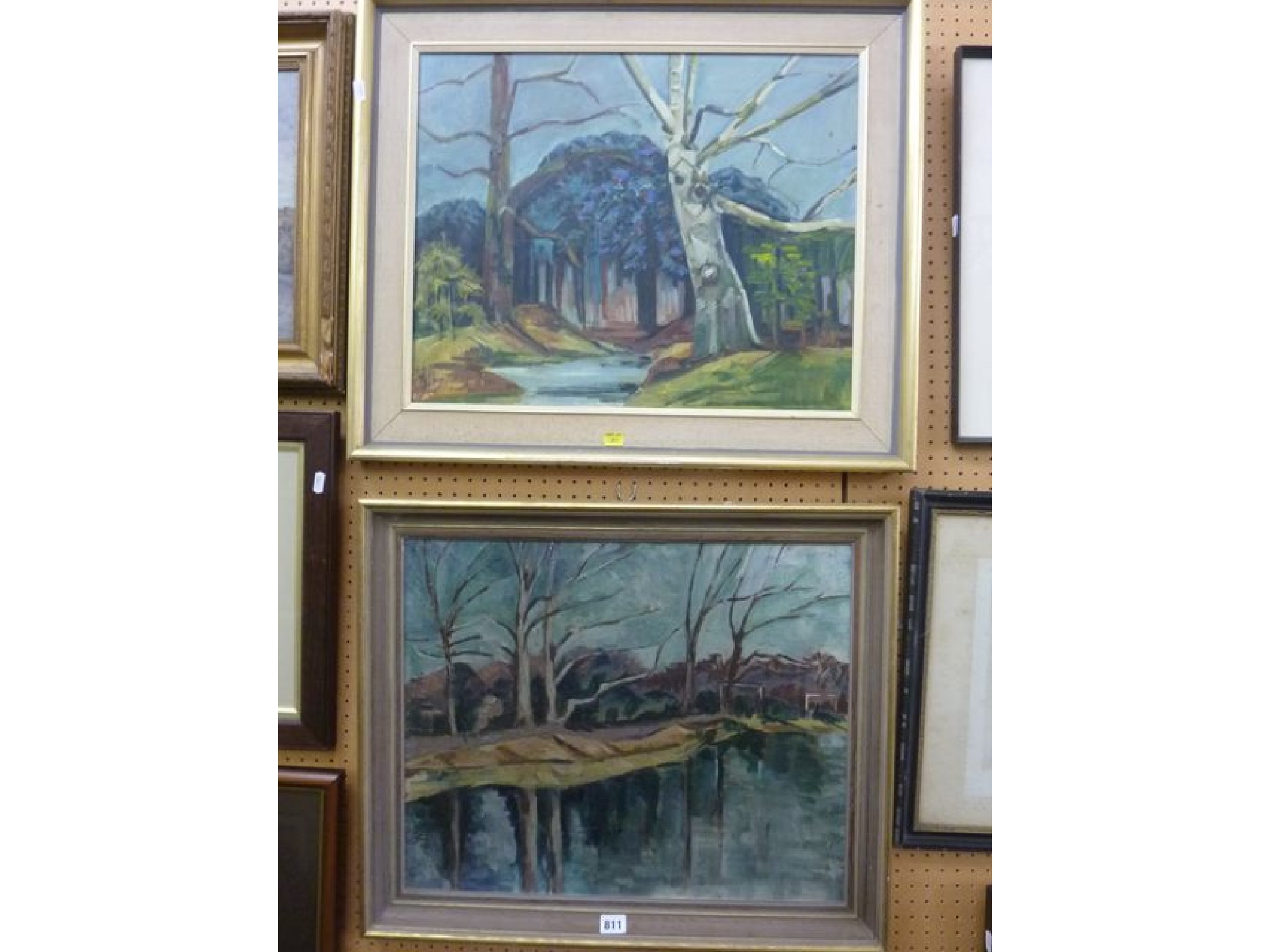 Appraisal: Two oil paintings of wooded landscapes with streams one on