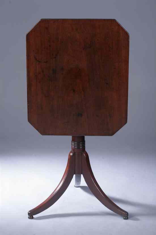 Appraisal: AMERICAN REGENCY MAHOGANY CANDLESTAND th century Rectangular tilt-top having chamfered