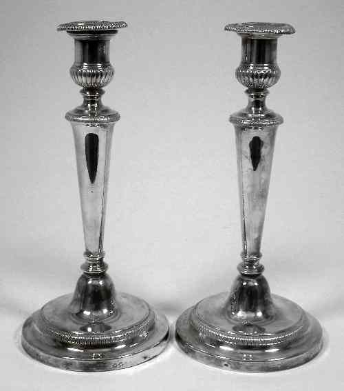 Appraisal: A pair of th Century Sheffield plate pillar candlesticks with