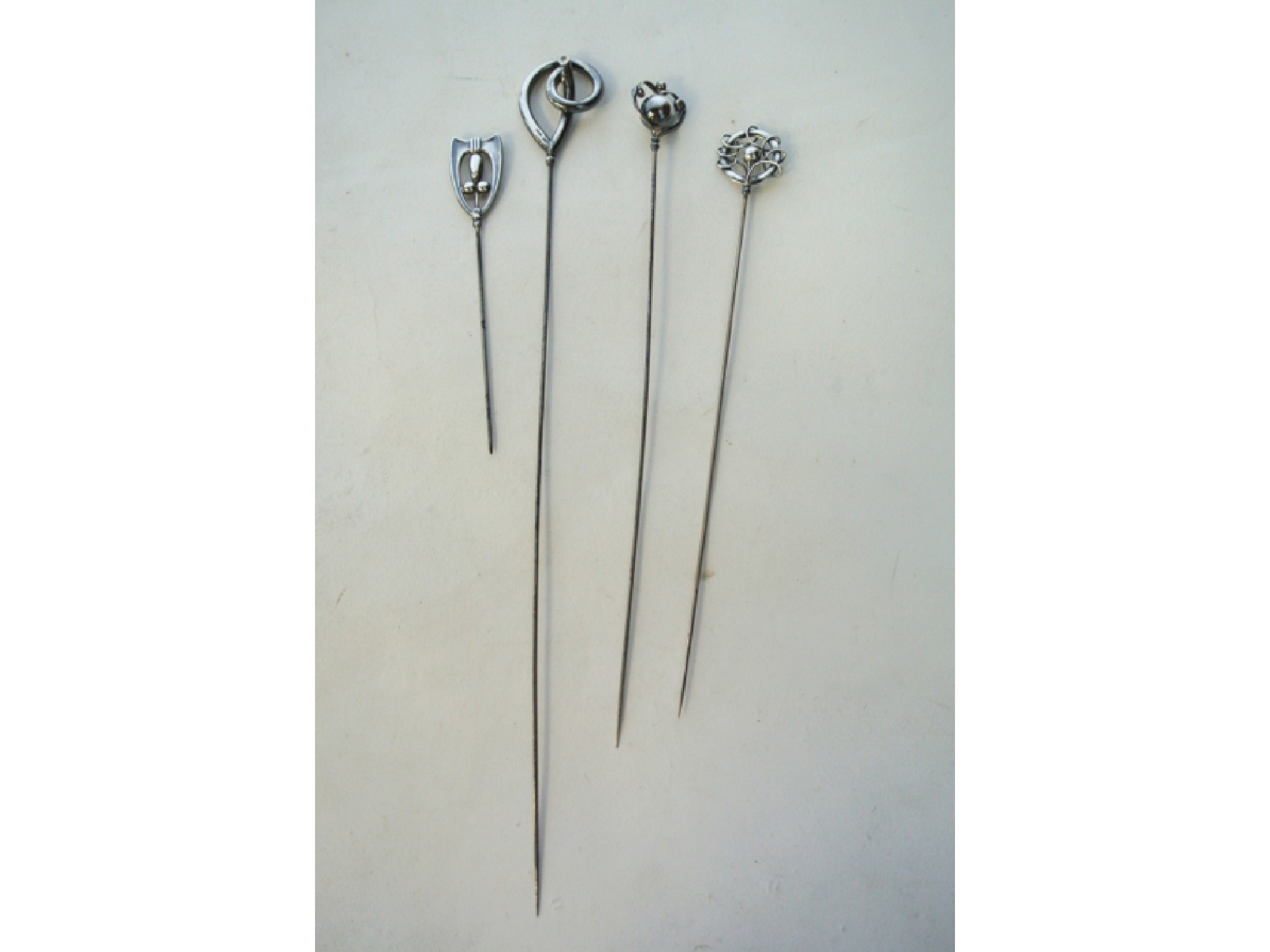 Appraisal: A collection of four silver hatpins Charles Horner Chester -