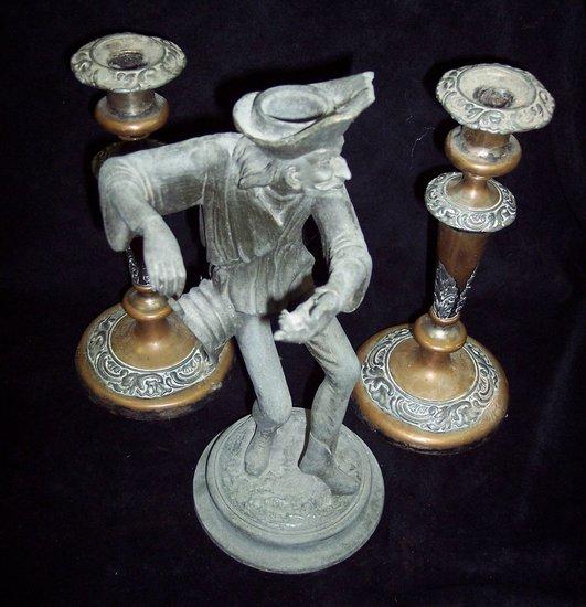 Appraisal: A spelter figural candlestick cm high and a pair of