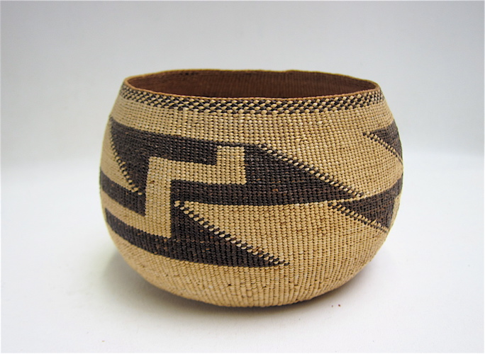 Appraisal: NATIVE AMERICAN BASKET twined basket with repeating geometric shapes tall