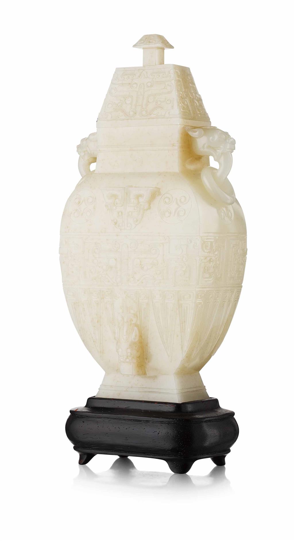 Appraisal: WHITE JADE ARCHAISTIC VASE AND COVER the vase of rectangular