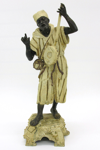 Appraisal: COLD PAINTED CAST IRON ARAB FIGURE of a male playing