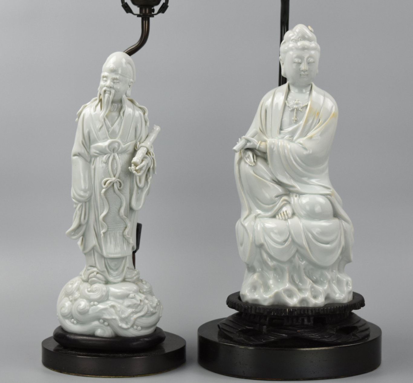 Appraisal: CHINESE DEHUA FIGURES GUANYIN SCHOLAR TH C A pair of