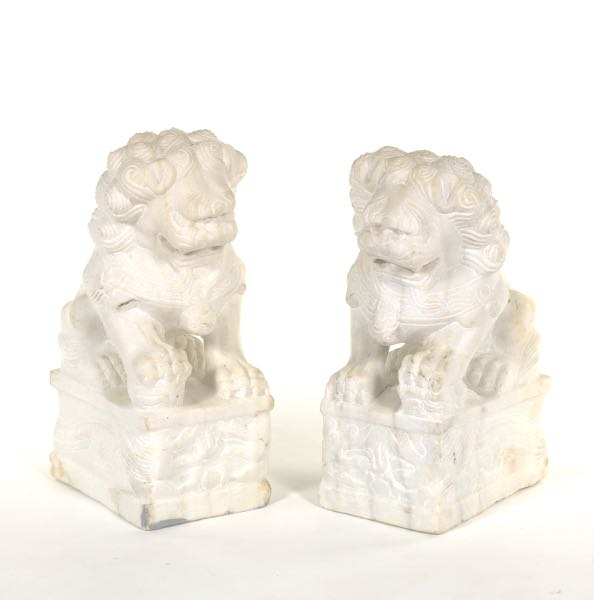 Appraisal: PAIR OF CHINESE CARVED MARBLE FOO LIONS ON DRAGON PEDESTALS