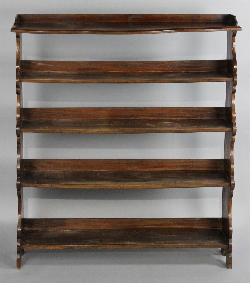 Appraisal: MAHOGANY FIVE-TIER FLOOR SHELF having five shelf levels with shaped