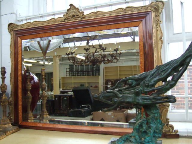 Appraisal: A mid Victorian over mantle mirror with internal satinwood frame