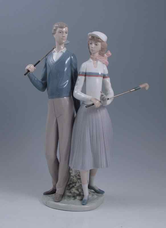 Appraisal: LLADRO GOLFING COUPLE Jose Puche issued retired glaze finish ''h