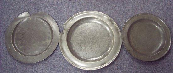 Appraisal: A pewter charger intialled EB cm diameter and a pair