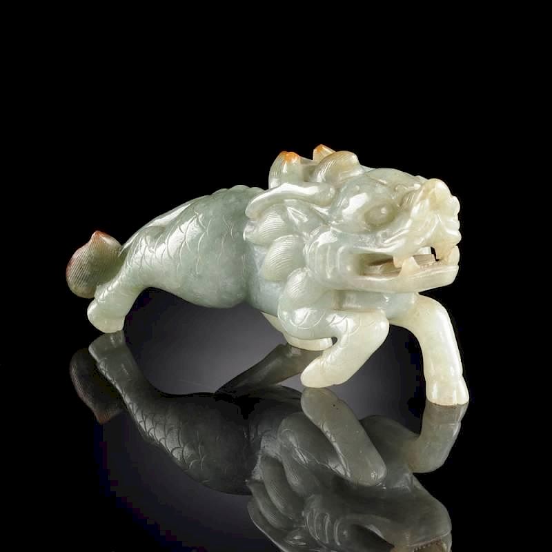 Appraisal: A CHINESE CARVED CELADON JADE FIGURE OF A MYTHICAL QILIN