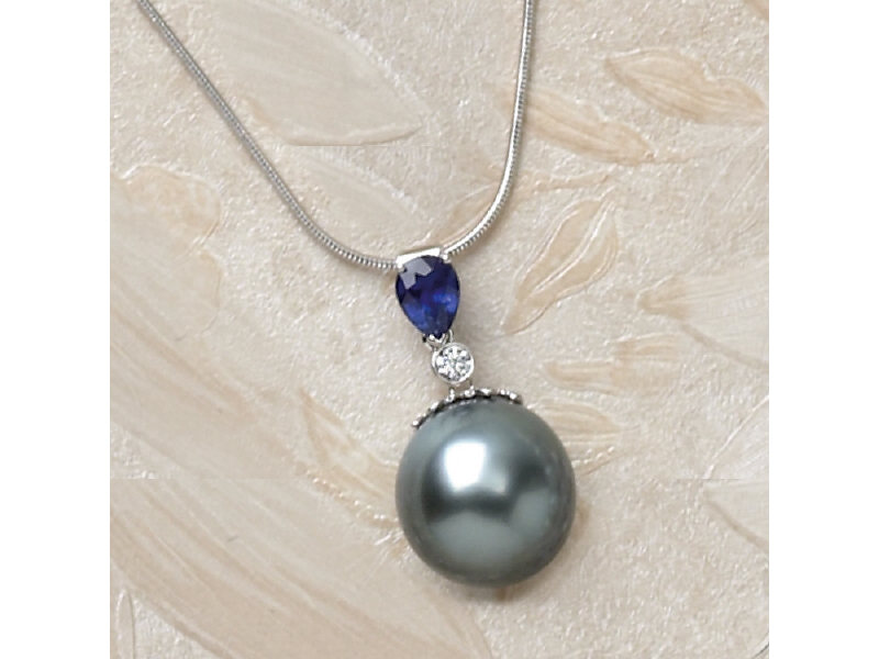 Appraisal: PEARL SAPPHIRE AND DIAMOND PENDANT k white gold pendant with