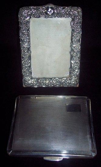 Appraisal: A cigarette case with engine turned decoration cm wide S