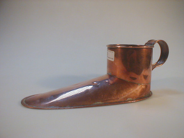 Appraisal: A thC copper Slipper ale muller with S shaped handle