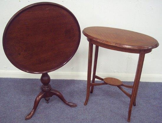 Appraisal: A mahogany circular table raised on a turned column with