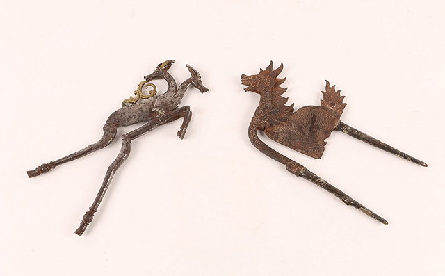 Appraisal: TWO PAIRS OF INDIAN BEETLE NUTCRACKERS with stylised animal decoration