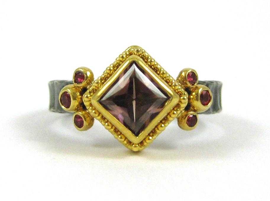 Appraisal: ZAFFIRO PINK ZIRCON AND RED SPINEL RING in granulated k