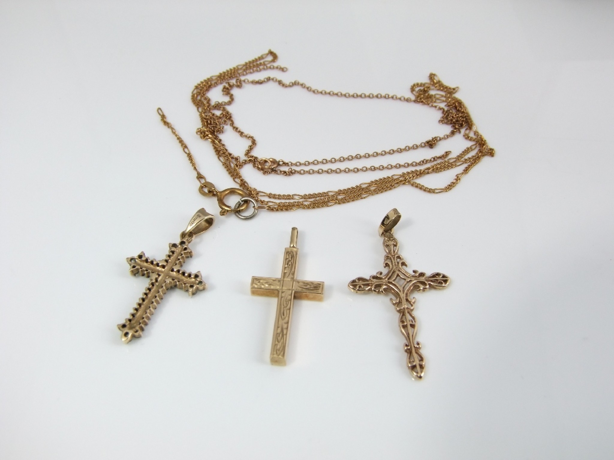 Appraisal: Three ct gold crucifix and two fine link chains gms