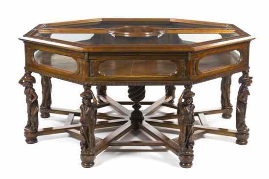 Appraisal: A Continental Carved Vitrine Table of octagonal form the split