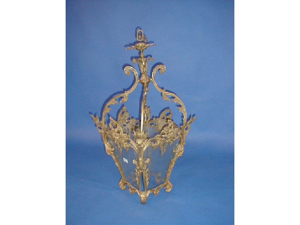 Appraisal: A rococo brass hanging four-glass lantern Provenance formerly the main