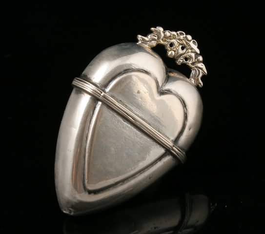 Appraisal: Heart shape with floral surmount late th century silver marks